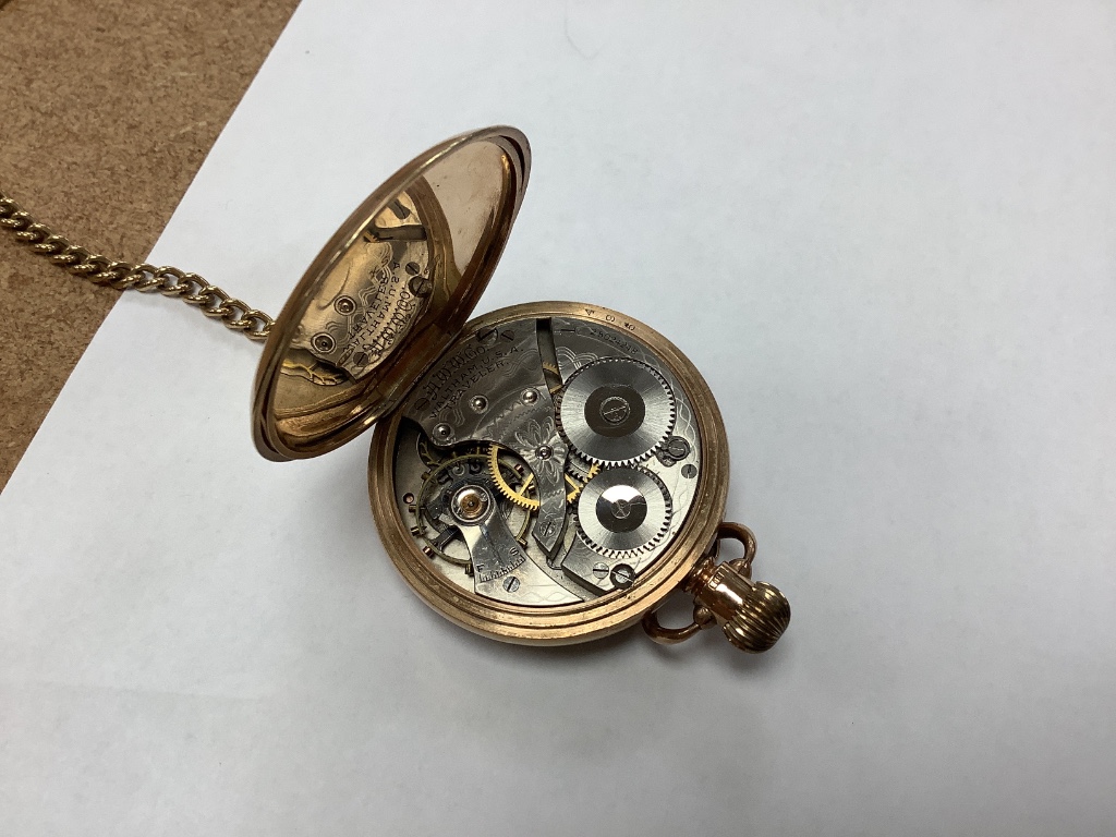 A Waltham 9ct gold keyless open face pocket watch on 9ct gold chain with swivel fob seal